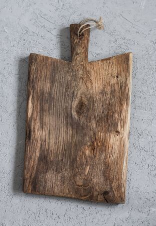 Empty vintage wooden cutting board. Top view, free spaceの写真素材