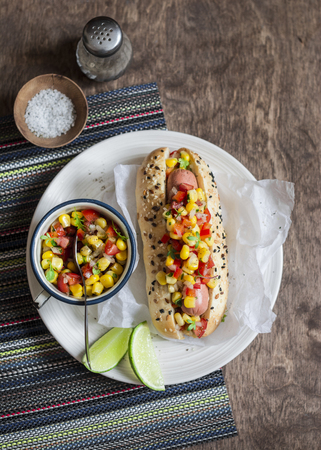 Mexican street style hot dog on wooden background, top view.の写真素材