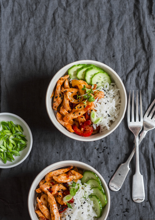 Asian style fried chicken and rice on a dark background, top view.の写真素材
