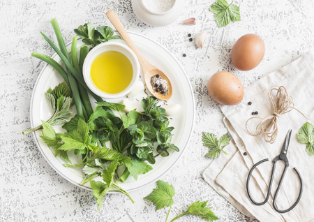 Garden herbs, spices and eggs rustic kitchen still life.On a light table, top view. Flat lay. Ingredients for cookingの写真素材