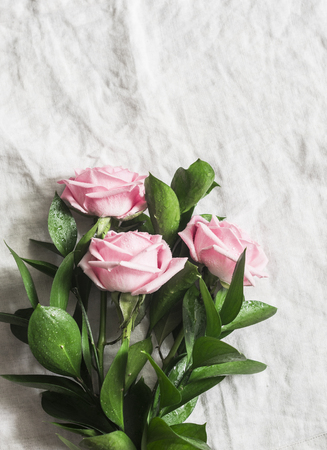 Pink roses on a light background. Top view, free space for textの写真素材