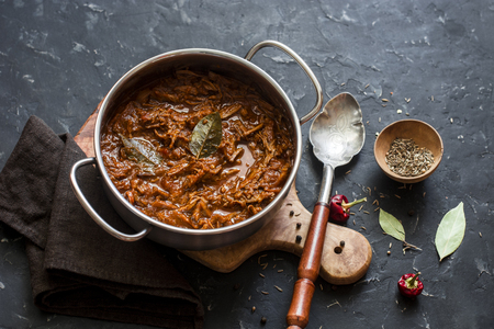 Slow cooker beef ragu. Crock pot braised beef on dark background. Delicious comfort healthy foodの写真素材