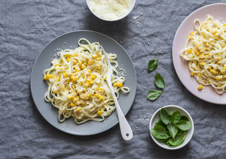 Creamy corn pasta. Linguine with creamy corn on a gray background, top viewの写真素材