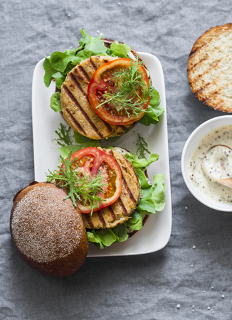 Vegetarian burgers - chickpea and cauliflower burgers on a gray background, top view. Flat layの写真素材