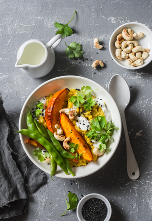 Pumpkin dhal. Traditional indian leguminous vegetables soup. Healthy vegetarian food concept. On a gray background, top viewの写真素材
