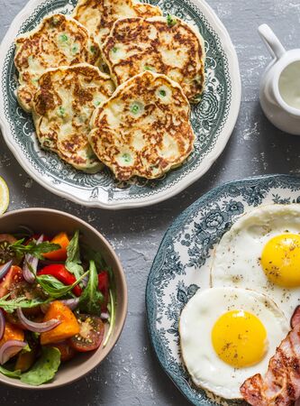 Breakfast - potatoes green peas pancakes, fried eggs, salad. Delicious, nutritious meals conceptの写真素材
