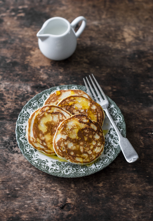 Pancakes with honey on a wooden table. Delicious breakfast, dessert or snackの写真素材