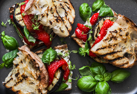 Grilled eggplant, pepper, ciabatta bread sandwiches - healthy summer snack. Picnic food, top viewの写真素材