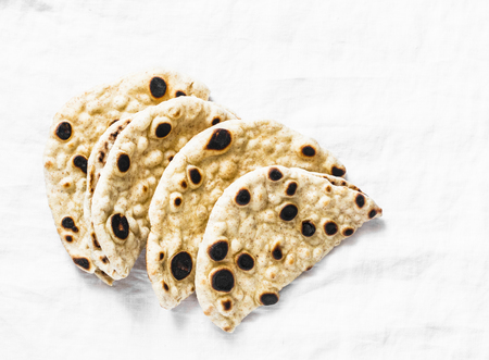 Homemade whole grain tortillas on a light background, top viewの写真素材