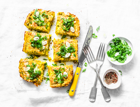 Turmeric, zucchini, mashed chickpeas tortilla with herbs on a light background, top view. Delicious appetizers or snackの写真素材