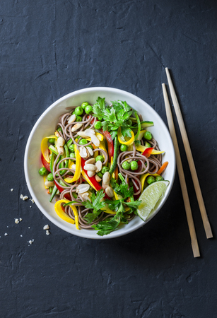 Pad Thai vegetables soba noodles on dark background, top view. Healthy vegetarian food in asian styleの写真素材