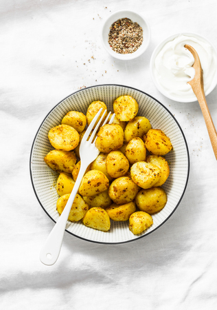 Bombay turmeric potatoes on a light background, top view. Delicious vegetarian lunch, snackの写真素材