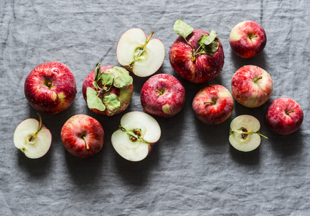 Fresh ripe red apples on grey background, top view. Flat lay, copy spaceの写真素材