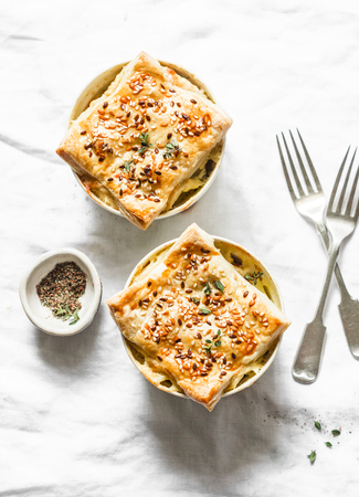 Chicken and vegetables creamy pot pie on a light background, top view. Flat layの写真素材