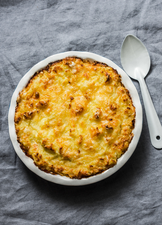 Chicken, bacon and leek cottage pie on a grey background,top viewの写真素材