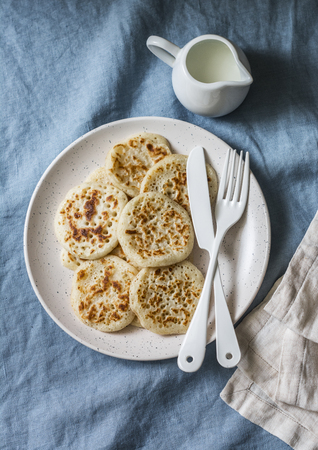 Sour dough pancakes - healthy breakfast, snack on a blue background, top viewの写真素材