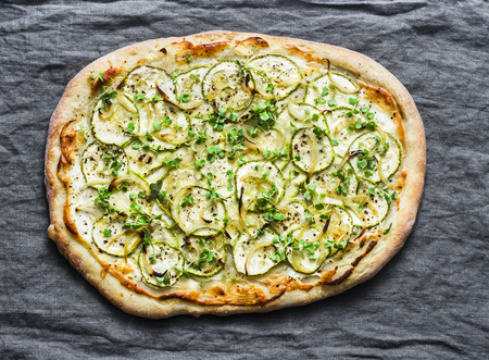 Vegan ricotta and squash pizza on grey background, top viewの写真素材