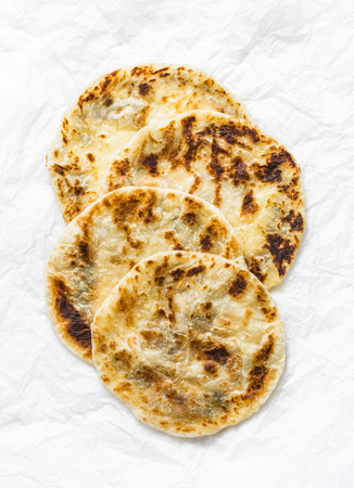 Indian paratha flatbread on a light background, top viewの写真素材