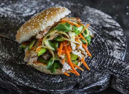 Pork Banh Mi burgers on a dark background, top view. Delicious food in asian styleの写真素材