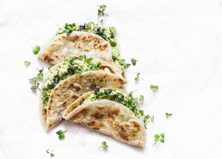 Avocado micro greens quesadilla on a light background, top viewの写真素材