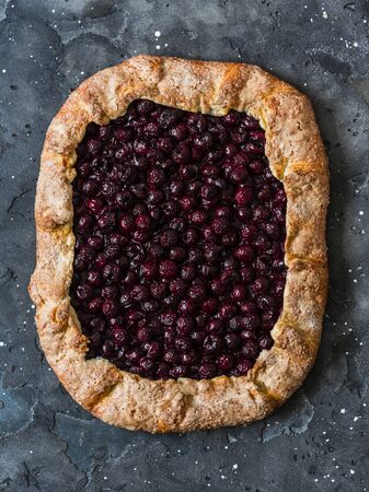Whole grain cherry pie on a dark background, top viewの写真素材