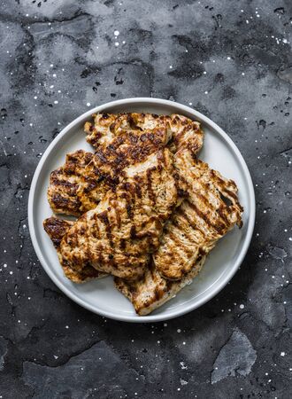 Turkey grilled chops on dark background, top viewの写真素材