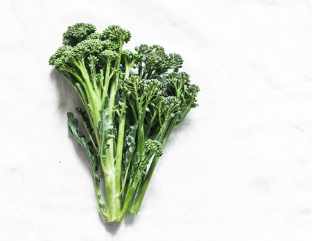 Bunch of fresh flowers broccoli cabbage on a light background top viewの写真素材