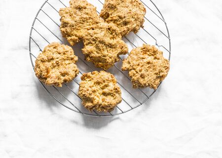 Cheese wholemeal flour biscuits on light background, top viewの写真素材