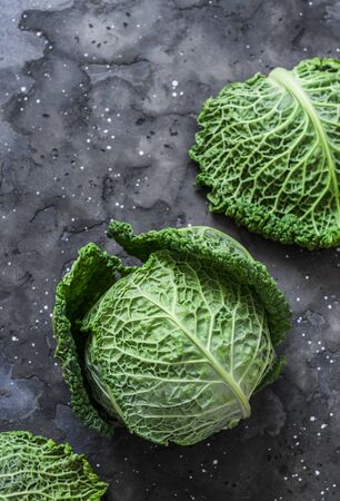 Fresh savoy cabbage on a dark background. the view from the top. Copy spaceの写真素材