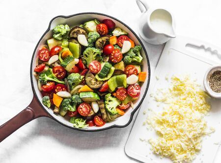 Vegetarian casserole ratatouille, baked in a frying pan on a light background, top viewの写真素材