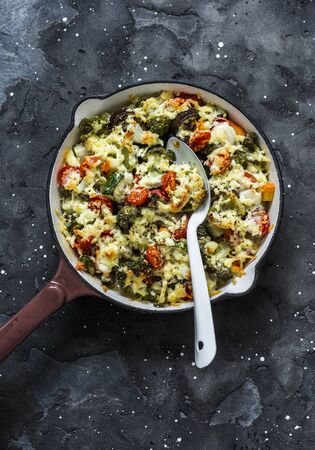 Vegetarian casserole ratatouille, baked in a frying pan on a dark background, top viewの写真素材