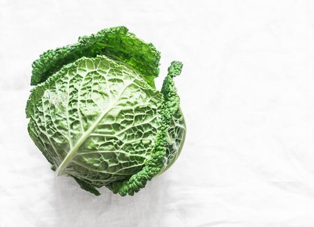 Fresh savoy cabbage on a light background. the view from the top. Copy spaceの写真素材