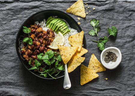 Rice with spicy beans beef minced with corn chips on a gray background, top view. Mexican style foodの写真素材