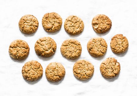 Delicious oatmeal gluten free cookies with walnuts on a light background, top viewの写真素材