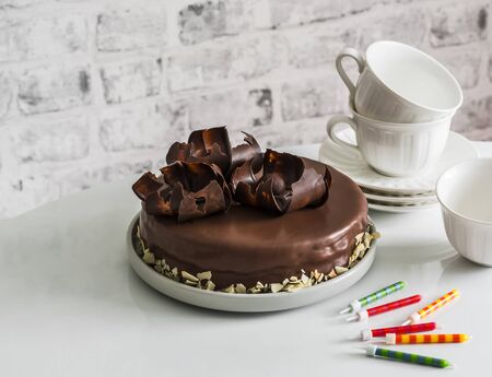 Simple homemade chocolate birthday cake  on the table. Holiday conceptの写真素材