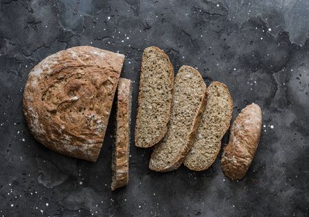 Gluten-free homemade healthy bread on a dark background, top view. Healthy food diet conceptの写真素材