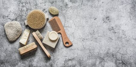 Body care health banner. Natural brushes, soap, pumice on a gray background, top view. Copy spaceの写真素材