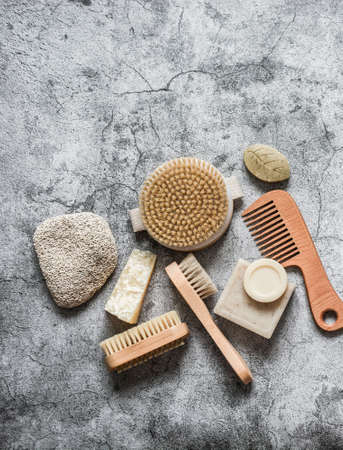 Body care health concept. Natural brushes, soap, pumice stone on a gray background, top view. Copy spaceの写真素材