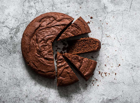 Chocolate brownie cake on a gray background, top view. Copy spaceの写真素材