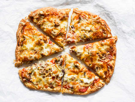 Delicious tapas, snack, appetizer. Canned tuna, tomatoes, mozzarella cheese puff pastry pizza on a...