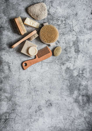 Body care health concept. Natural brushes, soap, pumice on a gray background, top view. Copy spaceの写真素材