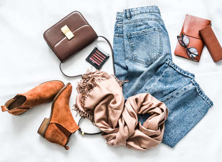 Women's clothing and accessories on a light background, top viewの写真素材