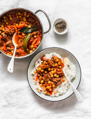 Beef stew with chickpeas and rice on a light background, top view. Delicious comfort balanced lunchの写真素材