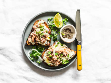 Sandwiches with smoked mackerel, cottage cheese and microgreens - delicious snack, appetizer, tapas,...