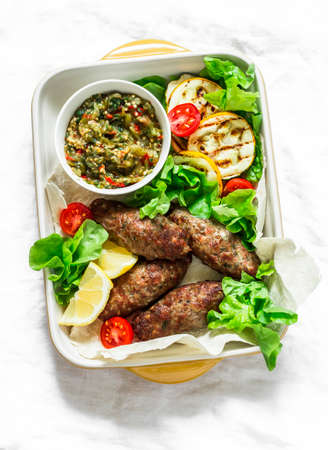 Roasted meat kebab, grilled vegetables sauce, zucchini, flatbread, green salad - delicious...