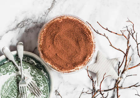 Delicious homemade tiramisu. Traditional Italian dessert on a marble background, top viewの写真素材