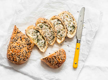Chicken, spinach, mozzarella puff pastry strudel on a light background, kind of superの写真素材