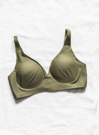 Fashionable seamless olive colored brat on a light background, top viewの写真素材