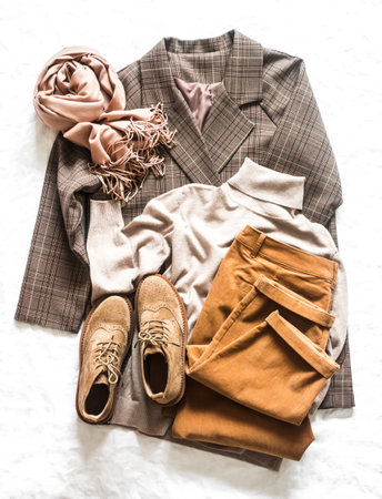 Women's autumn cozy clothes - corduroy trousers, plaid jacket, turtleneck, suede boots and cashmere...