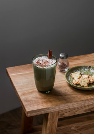 Pumpkin spice latte and cookies on a wooden table. Delicious snack, breakfast, dessertの写真素材